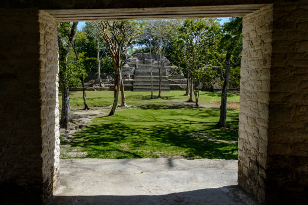 Pyramid at the Mayan ruins of Cahal Pech, Belize.  View of pyramid through doorway of temple.