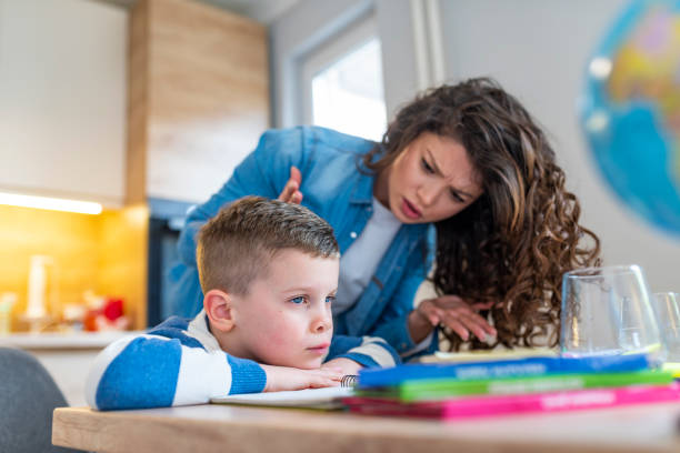 istock Mother Becoming Frustrated With Son Whilst Doing Homework 1133214302