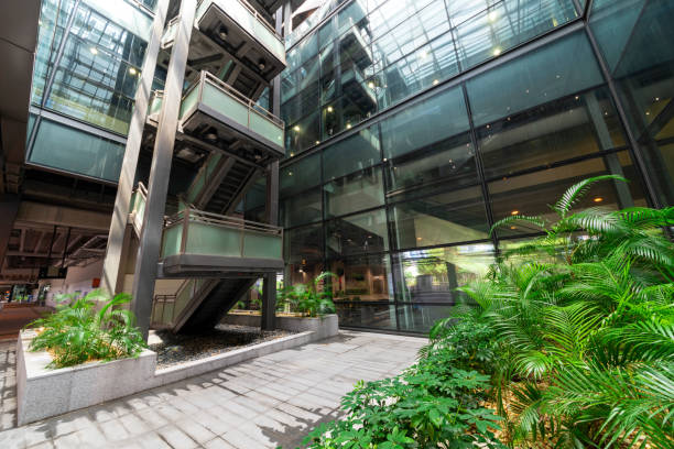 istock Modern glass elevator and pedestrian stairway entrances. 1133214762