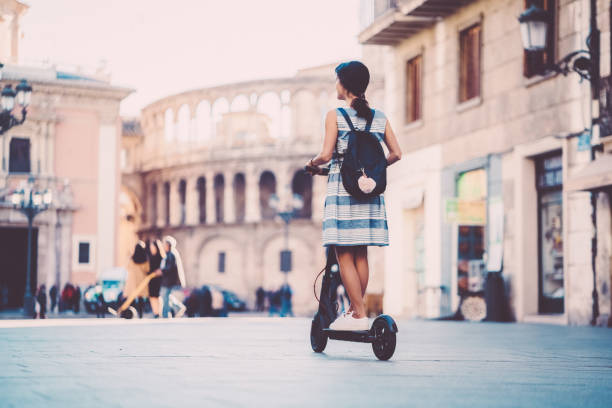 istock Woman riding motor scooter in Valencia,Spain 1133214849