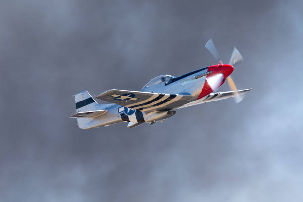 istock P51D Mustang (WWII American fighter plane) in beautiful light, against smoke 1133215448
