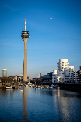 Rheinturm (Rhine Tower) and Skyline of Düsseldorf MedienHafen (Media Harbour) including the Gehry buildings, Neuer Zollhof