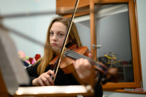 istock Girl playing violin 1133216008