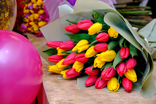 Mix of spring tulips flowers on the table.