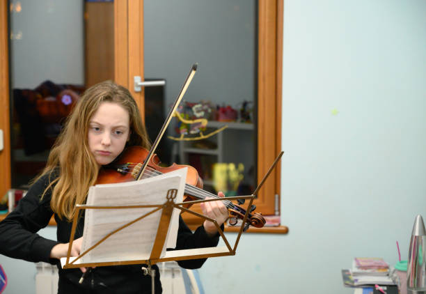 istock Girl playing violin 1133216795