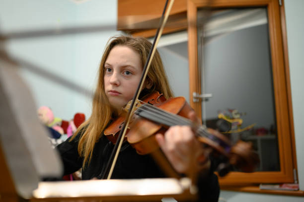 istock Girl playing violin 1133217084