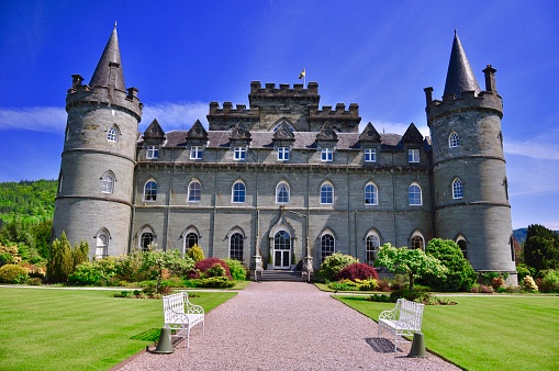 Iveraray, Scotland, UK - May 23, 2018: A brilliant example of Gothic Revival architecture, Iveraray Castle is well known to Downton Abbey fans as Duneagle Castle.