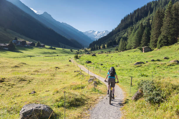 istock Mountainbiker is entering Dischma Valley, Davos. 1133217391
