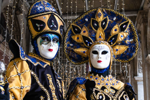 Carnival masks of Venice Models pose in the characteristic Venetian eighteenth century costumes in the district of Piazza San Marco evening ball photos stock pictures, royalty-free photos & images