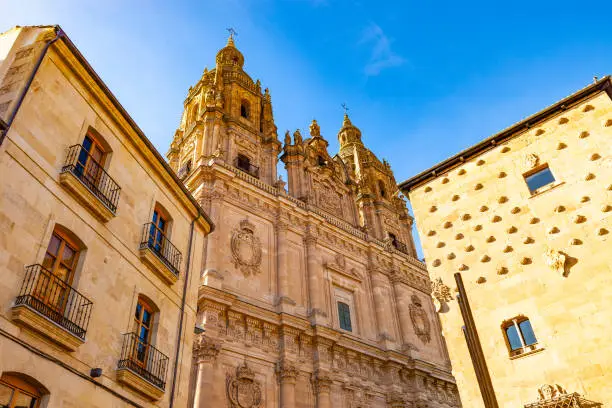 The Casa de las Conchas (House of Shells) and Iglesia del Espíritu Santo in the old town of Salamanca, Spain.  The church was built in 1617 and the House of Shells was built in 1517.