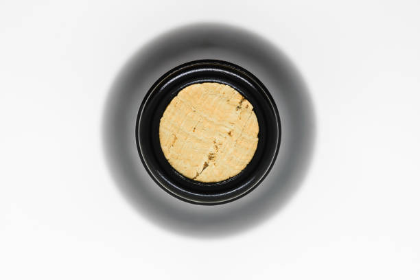 istock Closed with cork black glass wine bottle view from top on white background 1133224316