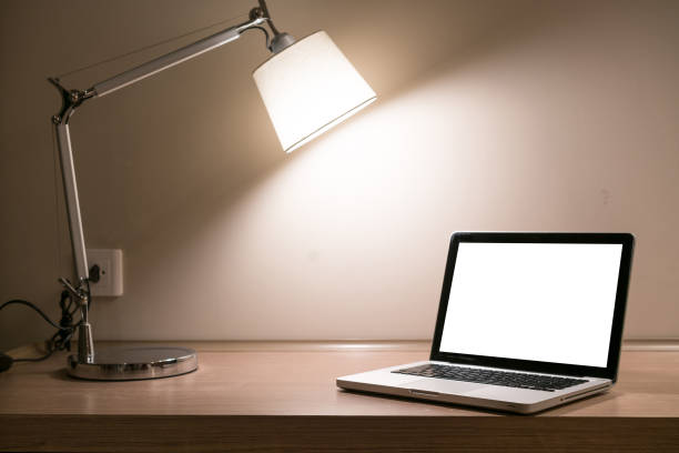 istock Laptop on a desk with lamp 1133226986