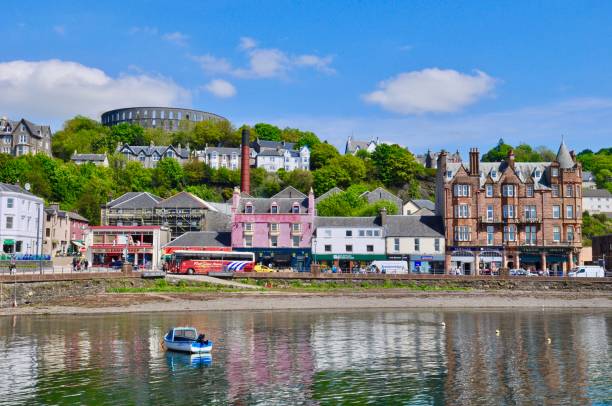 Oban, Scotland, UK - May 23, 2018: View of Oban’s town centre with a splendid view of coliseum-style McCaig’s Tower.