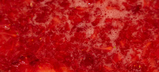 istock Making of strawberries with sugar on black table in white tile kitchen 1133236381
