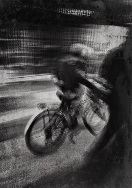 istock Monochrome defocused view of a man walking with bicycle 1133239603