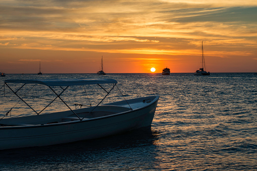 Boats anchored during a beautiful sunset