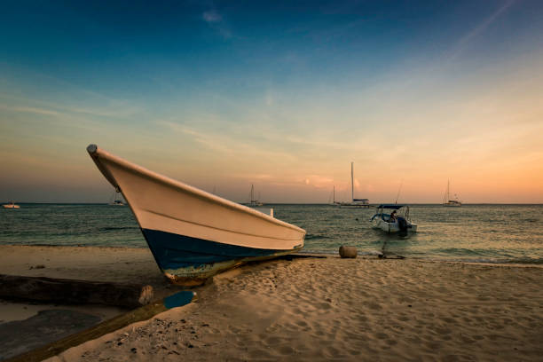 istock Boat anchored during a dramatic and beautiful sunset 1133239718