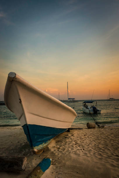 istock Boat anchored during a dramatic and beautiful sunset 1133239747
