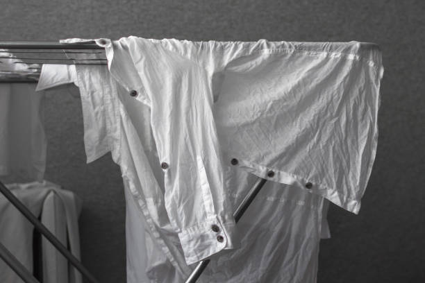 istock Crumpled white women's shirt on the dryer 1133240880