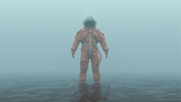 Astronaut in an Orange Advanced Crew Escape Suit with Black Visor Standing in Water in a Foggy Overcast Environment 3d illustration
