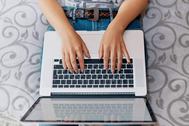 istock Woman working on laptop computer at home 1133242366