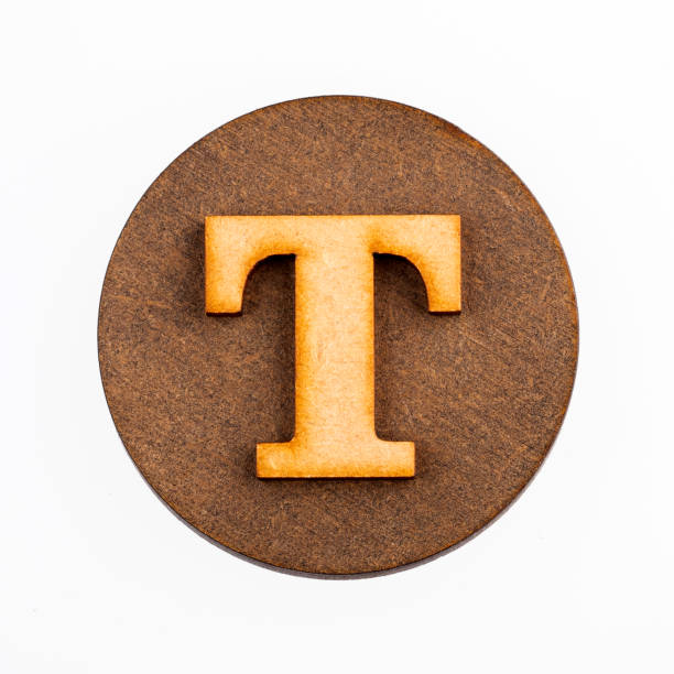 istock Letter T on a wood circle - Alphabet 1133242415
