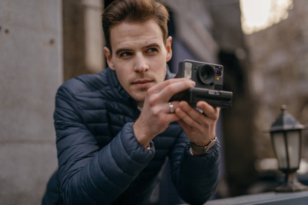 istock Tourist is photographing with old camera 1133245242