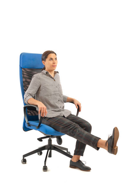 istock Woman sitting on her office chair and doing exercises 1133245563