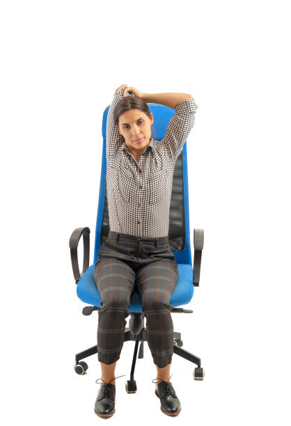 istock Woman making stretching moves while she is sitting on the office chair 1133246353