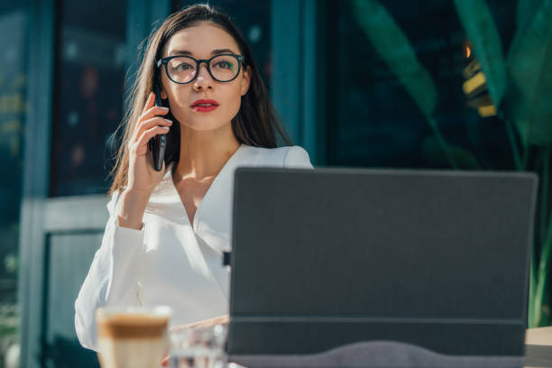 istock Young woman with eyeglasses is talking on phone 1133246863