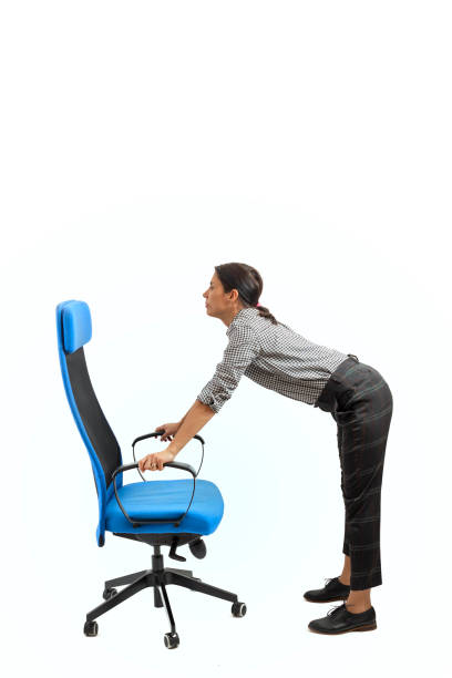 istock Woman doing exercises while sitting on the office chair 1133249947