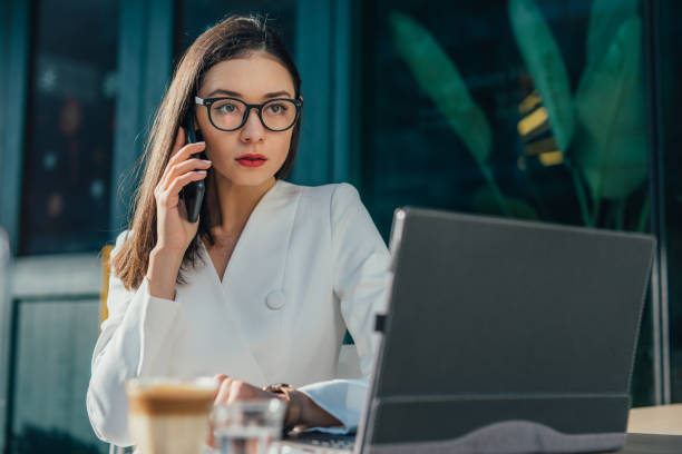 istock Serious, young woman with eyeglasses is having a phone call 1133250227