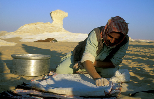 people bake fresh Bread in the white desert near the village of Farafra in the lybian or western desert of Egypt in north africa