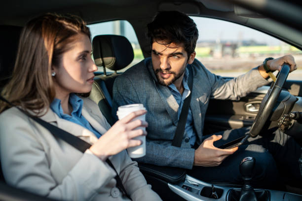 istock Business couple driving a car 1133253034