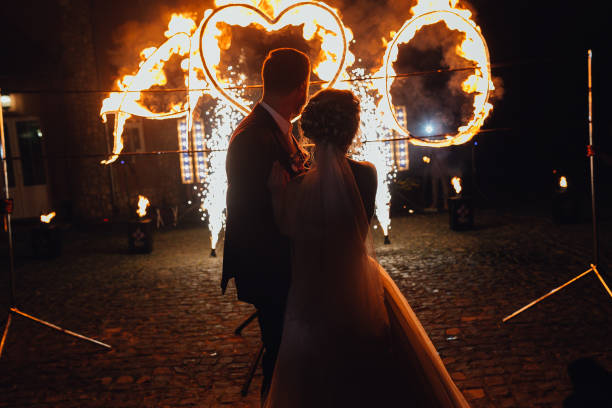 istock Loving wedding couple  watching fire-show 1133254202