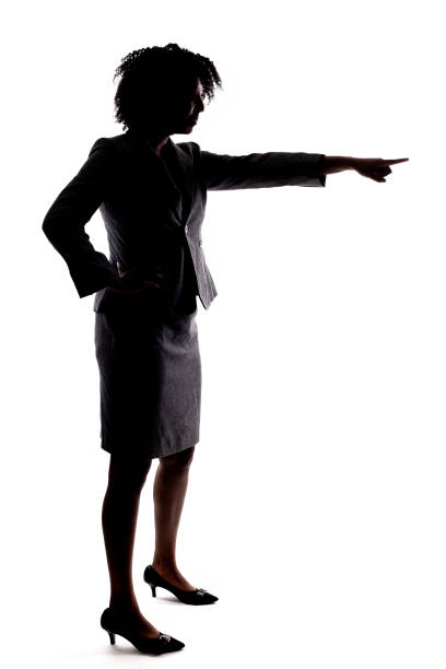istock Silhouette of a Black Businesswoman Pointing Forward 1133254263