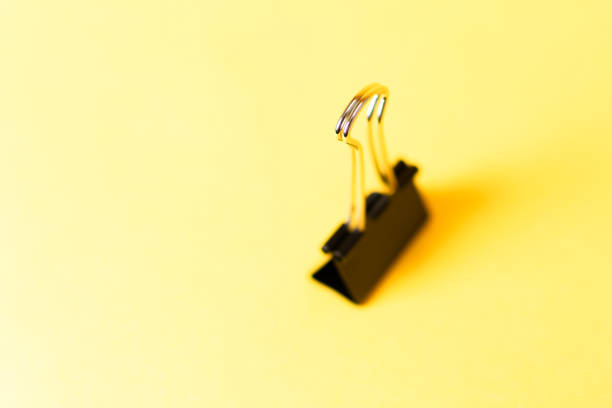 binder clip on colorful background stock photo