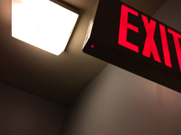 Exit sign in stairwell stock photo