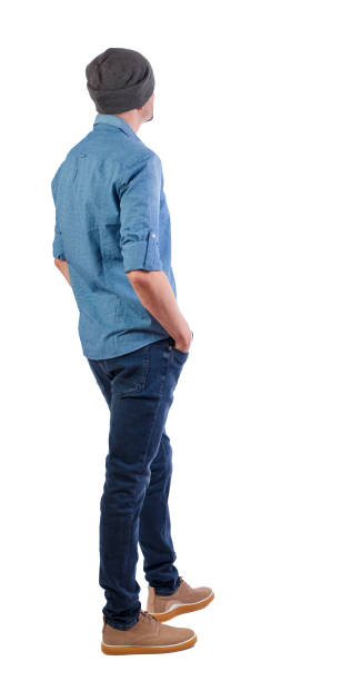 istock Back view of man in dark jeans. Standing young guy. Rear view people collection.  backside view of person.  Isolated over white background. A guy in summer clothes is standing with his back in his jeans. 1133258028