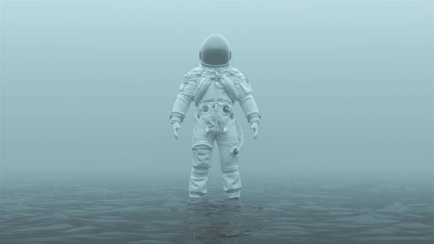 astronauta w białym zaawansowanym kombinezonie ucieczki załogi z czarną osłoną przeciwsłoneczną stojącą w wodzie w mglistym otoczeniu - gas range zdjęcia i obrazy z banku zdjęć