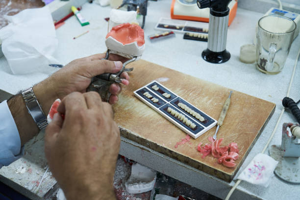 istock Dental technician dentist man working with dentures 1133258885