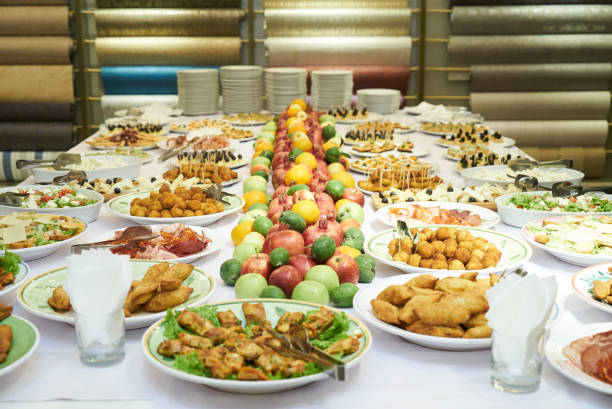 istock Catering table set service with cold snacks, canapes, fruits and 1133262305