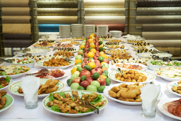 istock Catering table set service with cold snacks, canapes, fruits and 1133262309