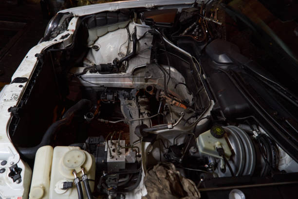 istock Car engine on crane hook in garage repair service, indoor 1133263708