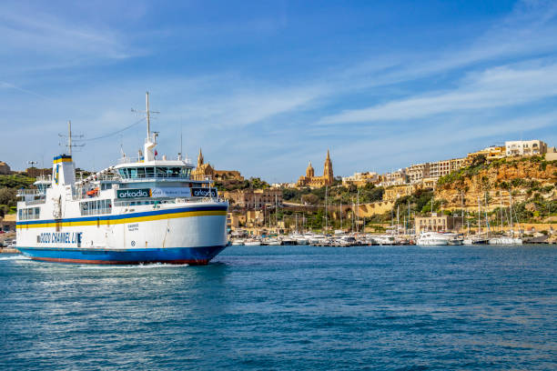 Gozo Channel Line ship at Mgarr Harbor in the town of Mgarr, Gozo, Malta Mgarr, Malta - March 07, 2018: Gozo Channel Line ship Gaudos at Mgarr Harbor in the town of Mgarr, Gozo, Malta mgarr malta island gozo cityscape with harbor stock pictures, royalty-free photos & images