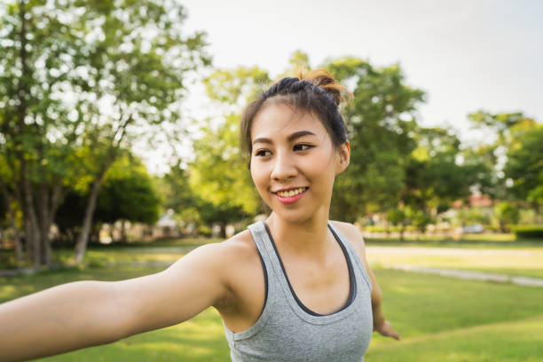istock Young asian woman yoga outdoors keep calm and meditates while practicing yoga to explore the inner peace. Yoga and meditation have good benefits for health. Yoga Sport and Healthy lifestyle concept. 1133275978