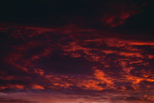 istock Fiery red blood vampire dawn. Amazing warm dramatic fire cloudy sky. Vivid orange sunlight. Atmospheric background of sunrise in overcast weather. Hard cloudiness. Storm clouds warning. Copy space. 1133276128