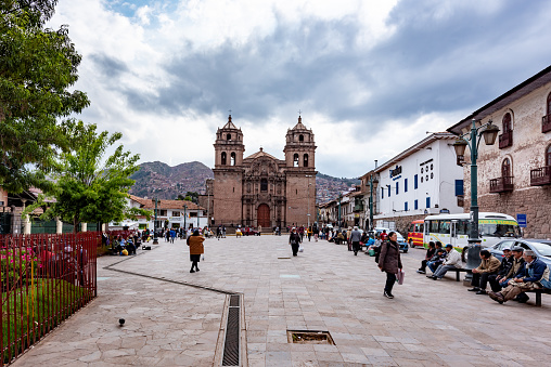 Cusco, Peru - Oct 17, 2018: Santa Clara Street Scene in central Cusco with old colonial architecture, some people shopping in store or walking around on street.