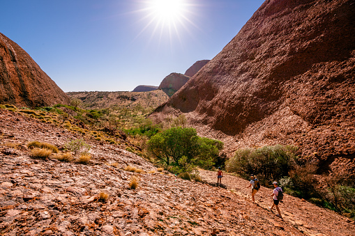 25th December 2018, NT Australia: People walking under blazing sun on hot summer sunny day in the Olgas NT central outback Australia