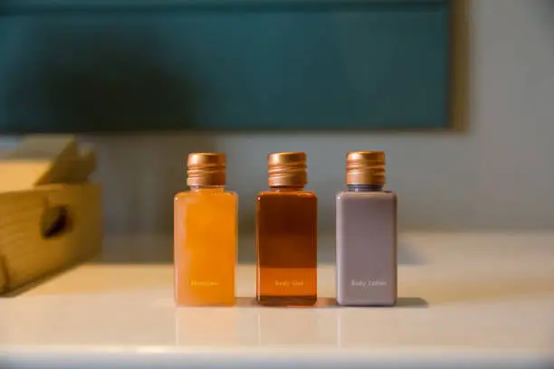 rectangle bottles of amenity set in bathroom